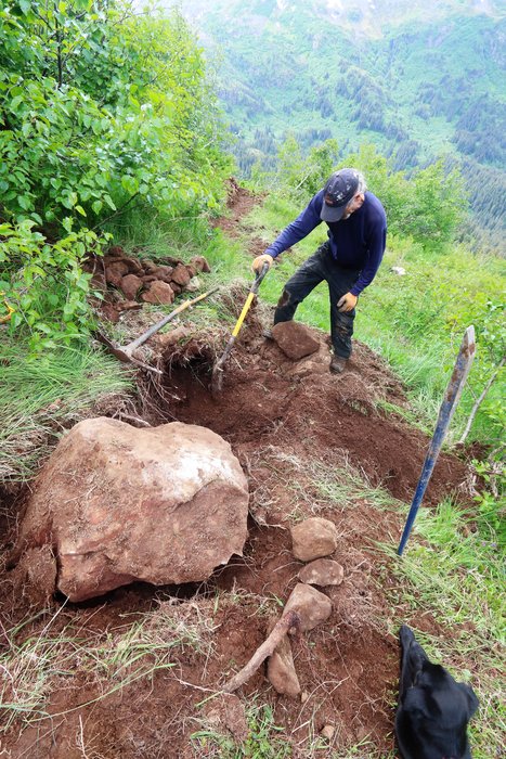 Byron sets a boulder into a socket for a step in Rosanna Meadow, on the south side of Sentinel Ridge.