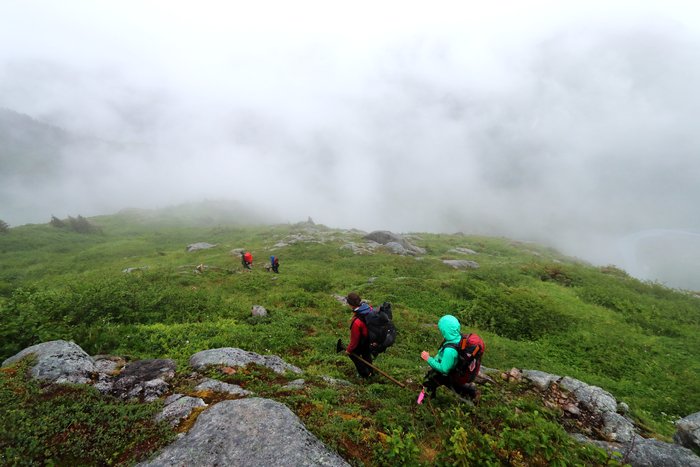 This mix of bedrock, tundra, and low brush makes for difficulties in laying out an easily followed trail without tons of work.