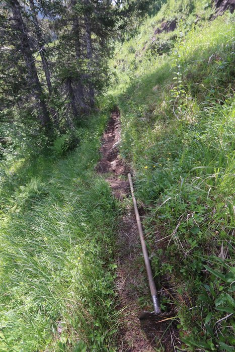 This short traverse is across a sheath of soil covering smooth bedrock, often with water running down it.
