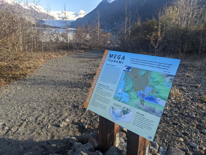A sign informs hikers about the risk of tsunamis at Grewingk Lake.