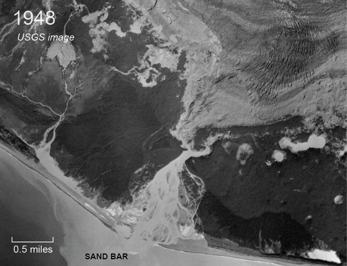 Fountain Stream pours out of the glacier edge, dumping sediment into a broad fan between the glacier and the ocean.
