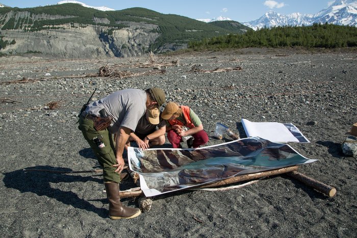 National Park Service ranger, Jim Capra, and Dr. Bretwood Higman look at aerial photos of Icy Bay before heading out into the field.  