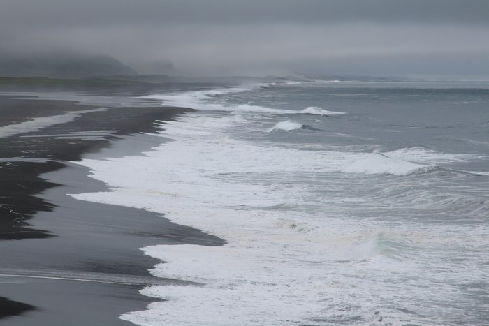 Waves wash onto the beach on Unimak Island
