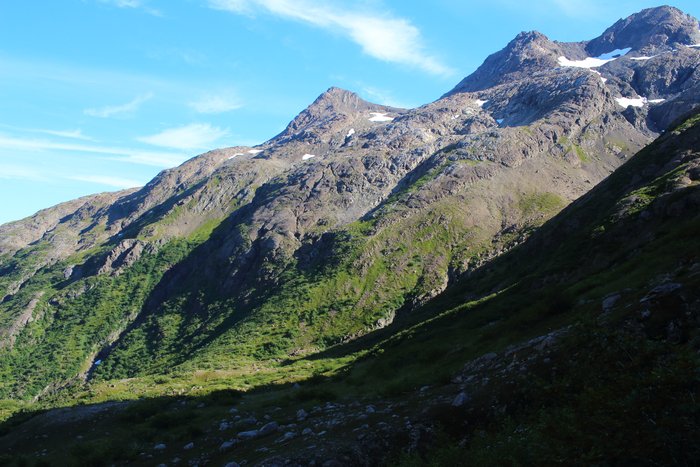 The <a href="http://www.groundtruthtrekking.org/tutka_backdoor/">Tutka Backdoor</a> trail climbs the flank of this mountain to skirt through the rocks above a series of gorges and thick brush in the valley below.