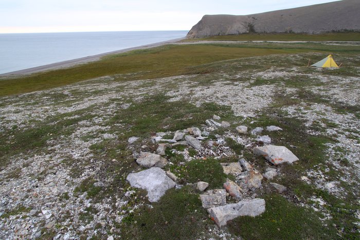 This circle of stones marks a grave, one of many on this hill.