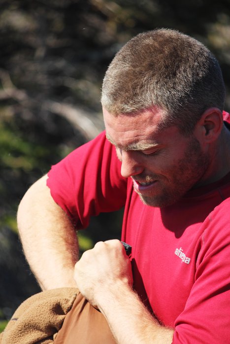 Andrew stuffs his "Oompa Loompa Suit" into a drybag.