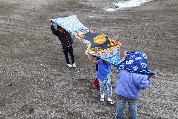 Sewn together from 3 African kangas, this lightweight baby wrap dried quickly and held little water