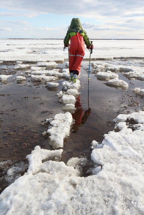 It isn't really open water around him, but it's drier if you can stay on the snow.