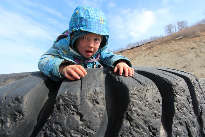 A gigantic wheel became a play structure on the beach.