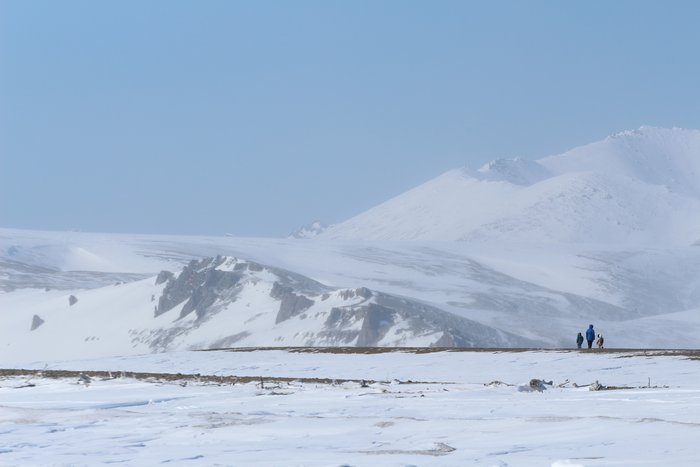 Erin and the kids walk along a beach blown clear of snow near Lost River.  The haziness in the background is blowing snow - it provides a visual indicator of where the wind is blowing strongest.