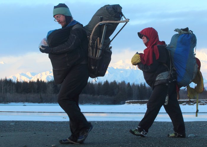 This journey involved around 100 miles of backpacking, and this was the most common way we traveled.  Kid on front in a wrap, packs on back.