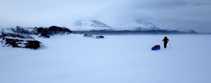 Kate trudges on in a windstorm on Lake Iliamna