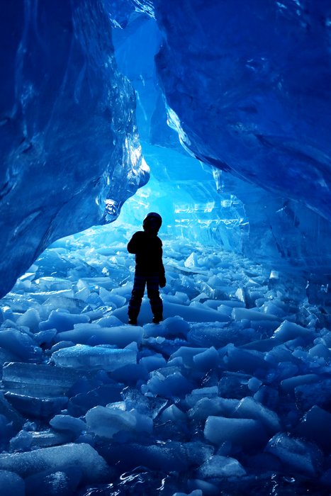 Lituya explores a cave filled with shattered lake ice, broken up by a calving event a week or so earlier. We have measured the depth of the lake near here, and it's hundreds of feet deep, but to all appearances when you're standing there you might be standing on solid ground.