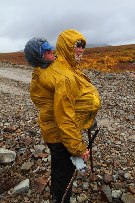 Erin stretched her coat around Katmai, her pregnant belly, and her front pouch.