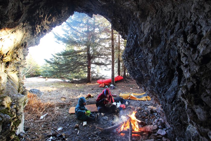 A small sea cave provided protection from the wind for a fire.