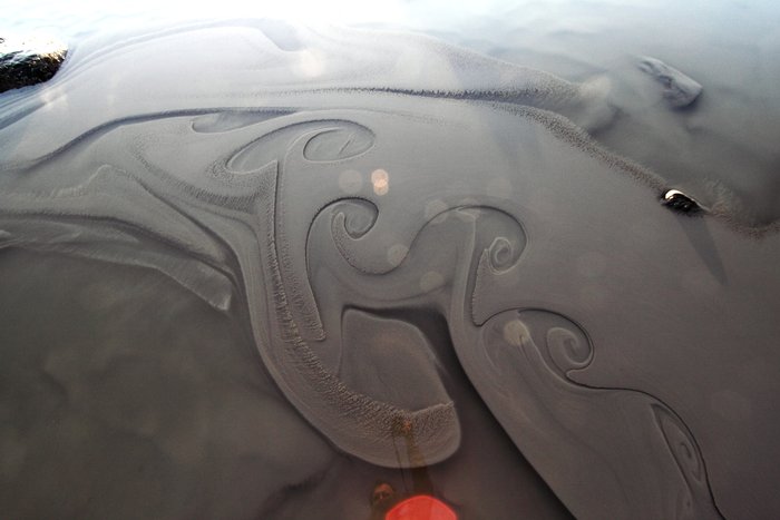 Clay washed down during a warm spell mixes with clear seawater.