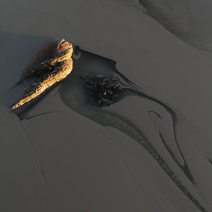 Clay washed down during a warm spell mixes with clear seawater.