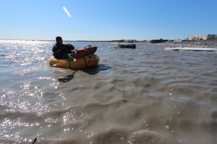 Erin filled a sample bottle with muddy Kenai River water for a climate scientist in Boulder Colorado.