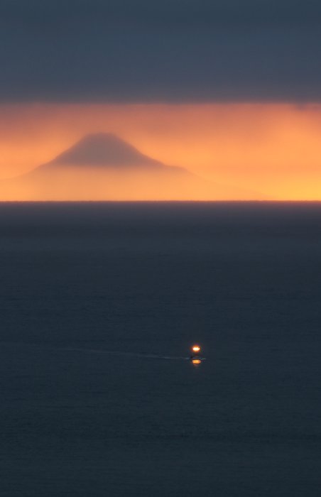 A fishing boat approaching Seldovia Bay, with Mt. St. Augustine in the distance.