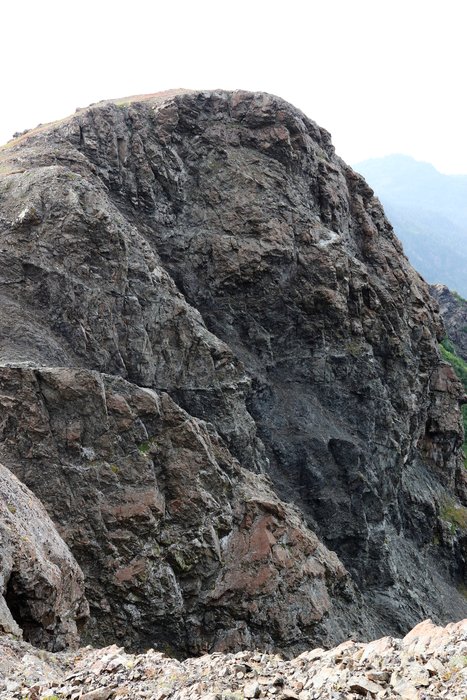 These cliffs in Kachemak Bay State Park reveal complex cracks and layers. These marine sedimentary rocks have been shoved and broken as they were scraped off the subducting Pacific Plate.