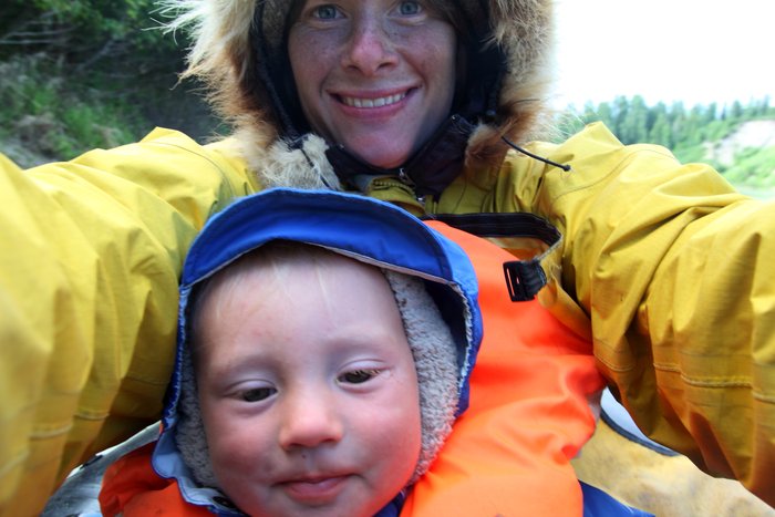 Erin and Katmai enjoy the break as Hig paddles the packraft