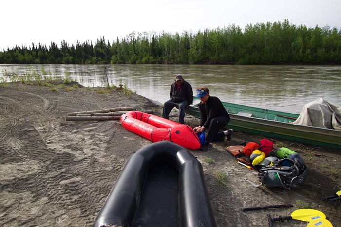 Bj&oslash;rn blowing up the pack rafts with an elder in the village of Nikolai. Even though Nikolai is many miles upriver from the mine, pollution could affect <a href=http://napaimute.org/2012/12/20/salmon-management-on-the-kuskokwim-dealing-with-uncertainty-complications-and-occasional-controversy/>residents ability to harvest food</a> from the river. 