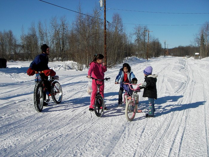 After being in Sleetmute for a few hours, local kids began riding their bikes on the hard packed snow trails too. We organized an impromptu bike race down the main road. 