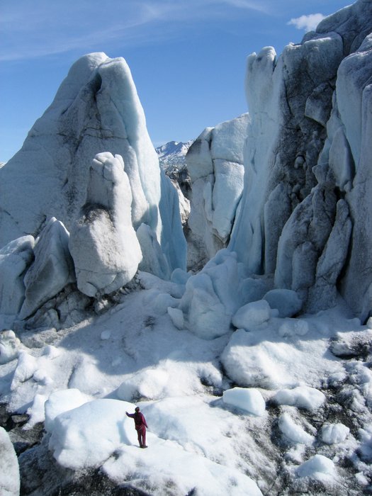 On the edge of Tustemena Glacier, Arctic Lake periodically fills and drains as the ice blocks and opens around it.