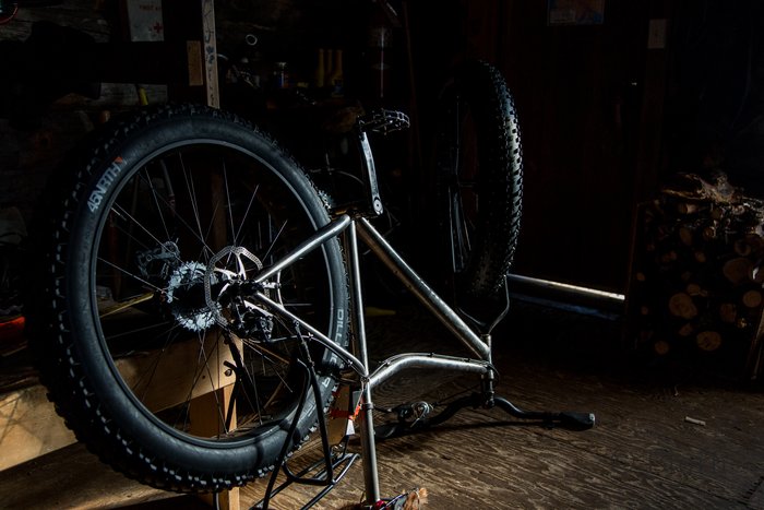 After hundreds of miles and daily use Bjørn's fat-bike needed some attention. Thankfully Tripod Flats shelter cabin was available for the travelers to do the necessary gear repairs in.