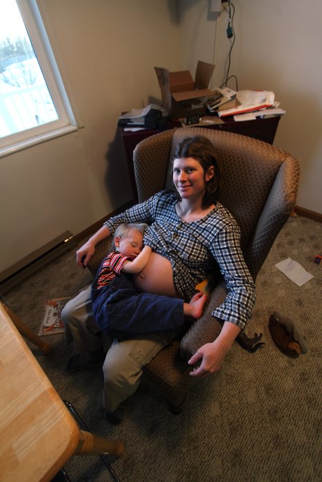 Katmai finds a little room to sleep on mom's crowded lap.