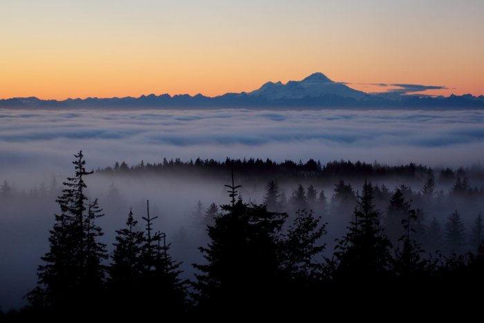 Low fog on Cook Inlet provides an incredible foreground for Iliamna Volcano.
