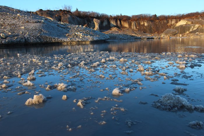 Supercooled water from underneath the glacier bubbles up here in a spring.  Freezing when it hits the lower-pressure surface, these chunks of ice pop up suddenly in the middle of the lake.