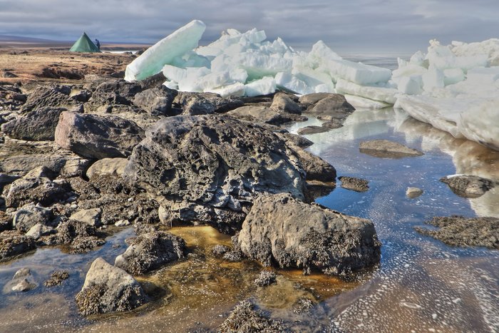Overnight, currents drove weak spring ice over boulders to form a 6 foot thick jumble along the shore near our camp.  We slept through it all.
