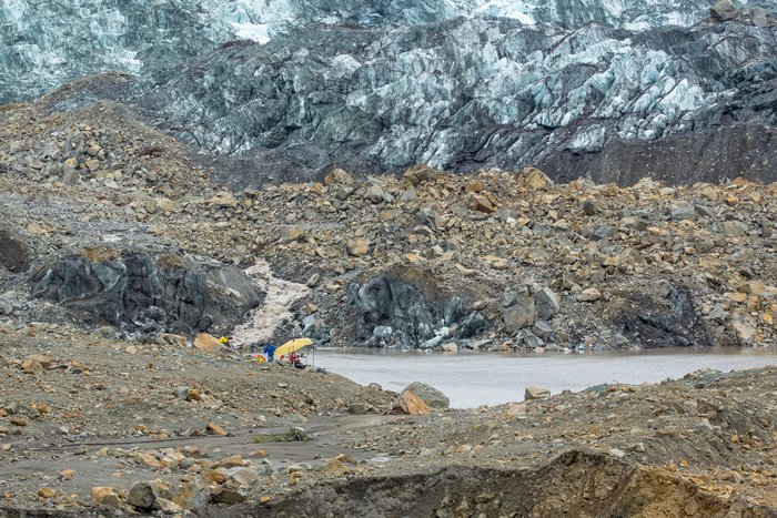 The marine survey crew works from the Western shore of Taan Fjord, near the glacier snout, atop landslide debris. Over the course of a week, the marine survey team mapped several shallow-water locations but most importantly was near Taan Glacier, where the landslide occurred. 
