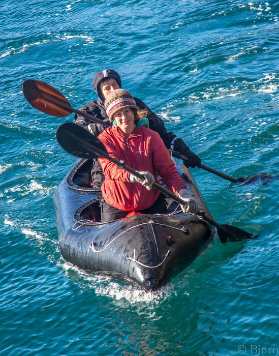 Erin and Kim paddle hard to see what the hull speed of the new boat is.