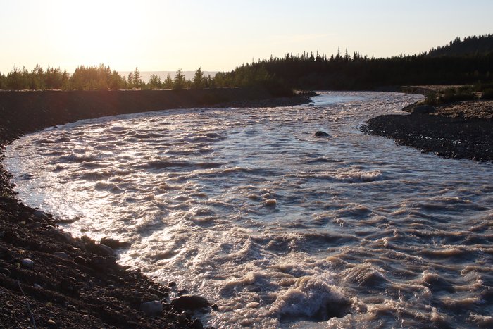 The water is high in the rapids on the upper Grewingk River.