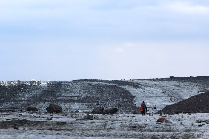 A gentle swale cuts across the gravel stripes on Malaspina's surface.