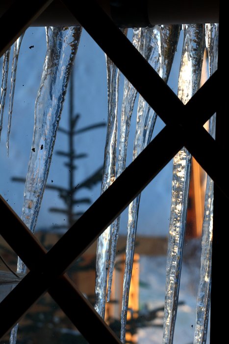 Icicles decorate the windows of the yurt.
