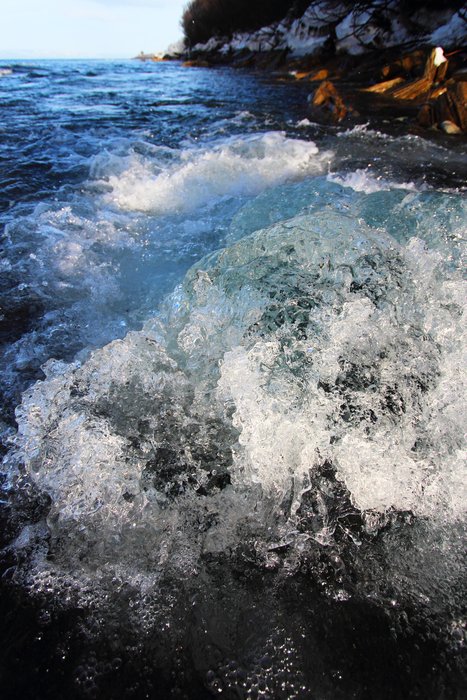 Water boils up from beneath an ice dam into the ocean at the outlet of Barabara Creek