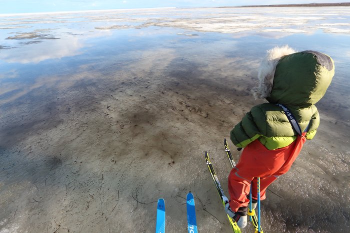 Skiing across spring's darker wetter ice