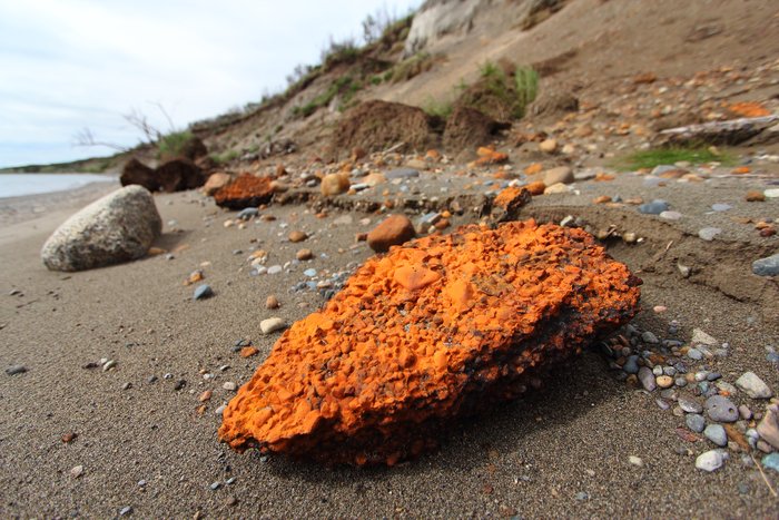 Gravels cemented by iron oxide, eroded from a layer that was likely deposited only a few thousand years ago.