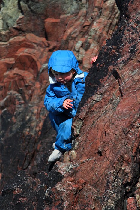 Testing his climbing skills on the folded chert at McDonald Spit
