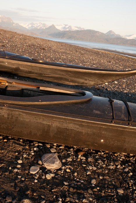Kayaks on the coast of the Homer Spit loaded and ready for departure