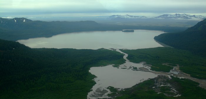 An aerial view of Kushtaka Lake, looking out over the Bering River Delta