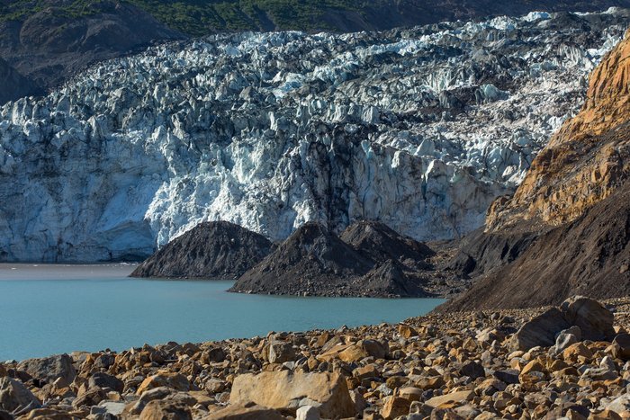 Conical hills, or hummocks, formed both under the water and across the fjord from the landslide. This phenomena is not fully understood. 