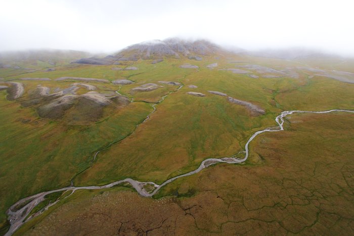 Rolling tundra and rocky uplands arc south from Cape Lisburne to Cape Thomson on the northwest coast of Alaska.