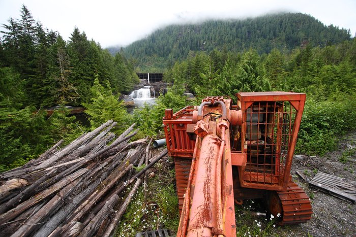 An abandoned piece of machinery provides a view of the dam near the head of Surf Inlet on Princess Royal Island.