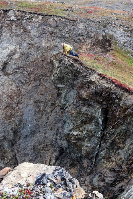 A rolling tundra ridge gives way to steep cliffs above Grewingk Lake.