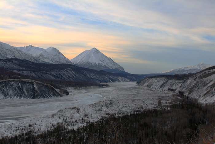 Gravel, ice, and willow floodplains make up the frozen Matanuska River.