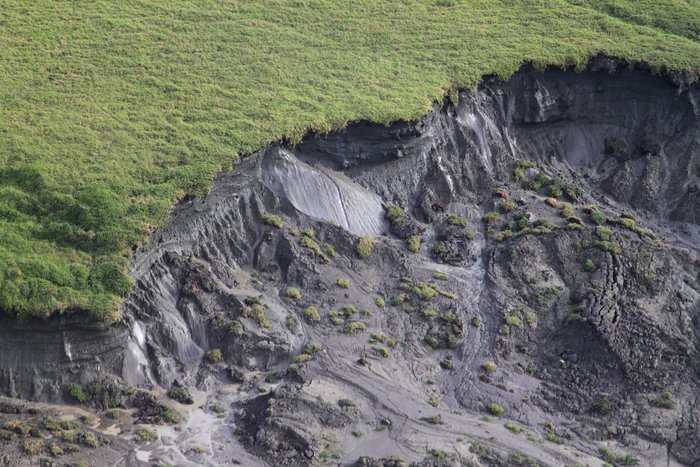These photos depict signs of permafrost melting and coastal erosion.